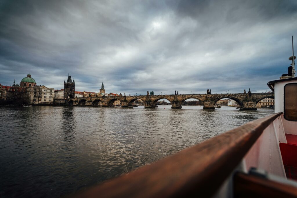 View of the historic Charles Bridge spanning the Vltava River in Prague, Czech Republic.